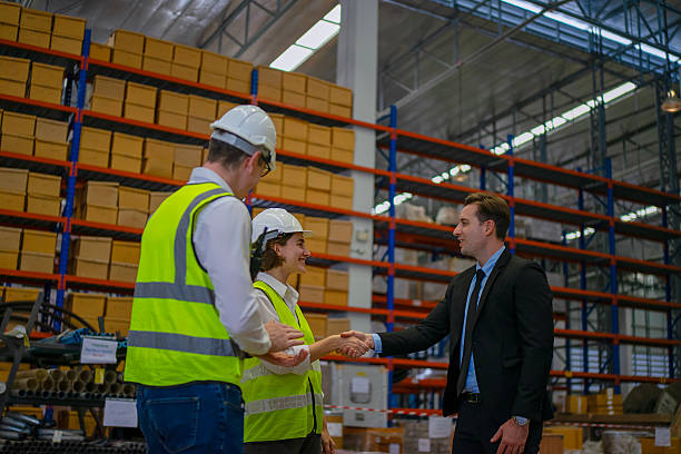 istock Blue collar workers are working and meeting at warehouse. 2220205166