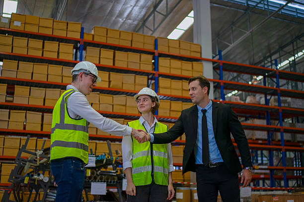 istock Blue collar workers are working and meeting at warehouse. 2220205175