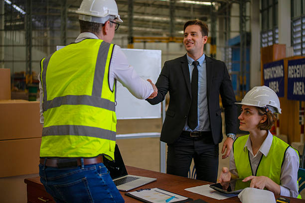 istock Blue collar workers are working and meeting at warehouse. 2220205187