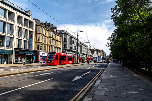 Edinburgh UK  12th June 2025  \nPrincess Street in Edinburgh with people trams and buses.