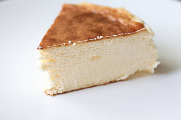 Close-up of San Sebastian cheesecakes on a white plate in slow motion