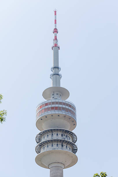 istock Tall Communication Tower with Red and White Antenna 2220217214