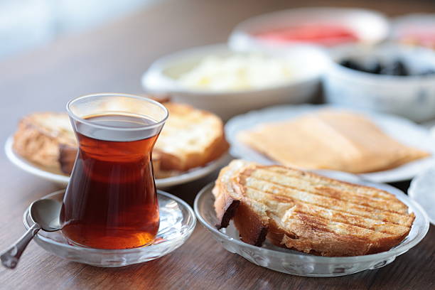 Turkish style breakfast: eggs, chechil cheese, white cheese, kashar cheese and Turkish tea,close up