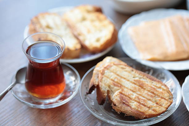Turkish style breakfast: eggs, chechil cheese, white cheese, kashar cheese and Turkish tea,close up
