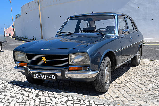 Peugeot 504 GL Diesel Sedan (1968-1975) in a parking lot in Fox do Arehlo, Portugal.