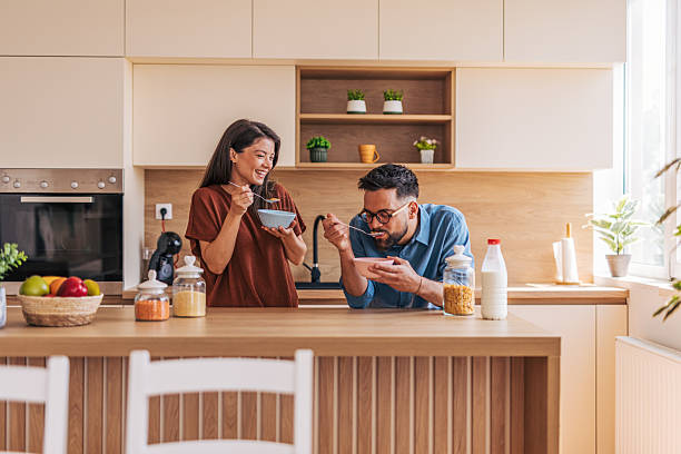 istock Happy couple enjoying breakfast together in modern kitchen 2220219021