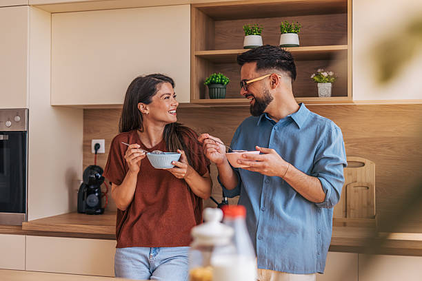 istock Happy couple enjoying breakfast together in modern kitchen 2220219282
