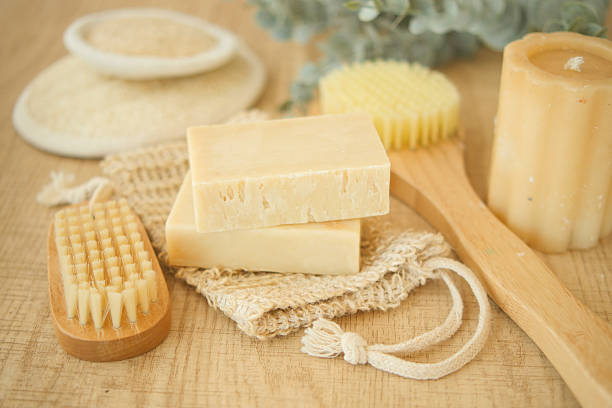 istock Natural handmade soap and brushes on wooden table in calm setting 2220219622