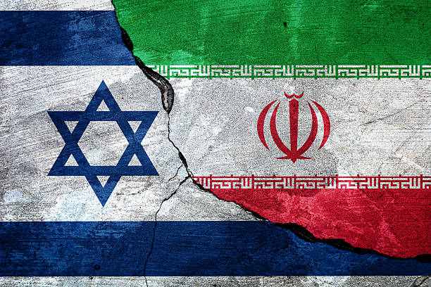 istock Israel and Iran flags on cement background. 2220220723