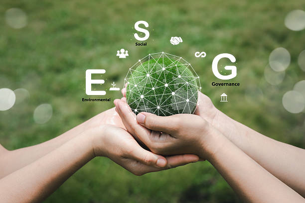 istock Hands Holding Green Sphere Representing ESG Principles in Nature 2220220727