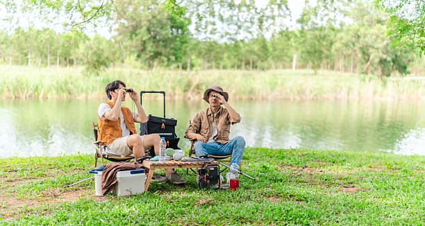 istock Friends Planning by the Lakeside Camp 2220223911