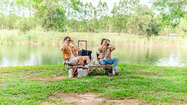 istock Friends Planning by the Lakeside Camp 2220223912