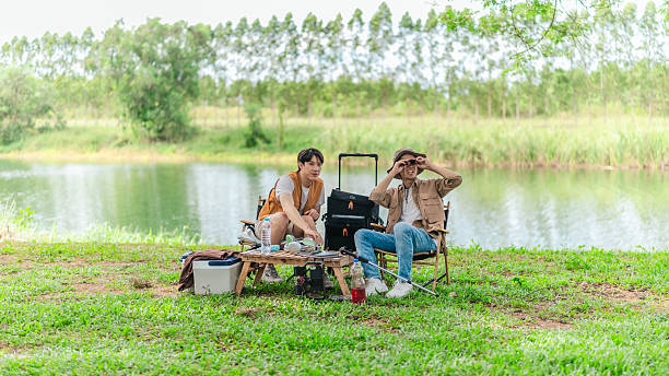 istock Friends Planning by the Lakeside Camp 2220224610