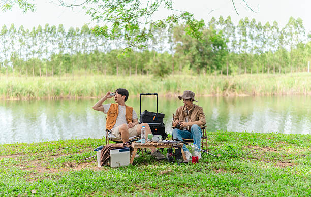 istock Friends Planning by the Lakeside Camp 2220224633