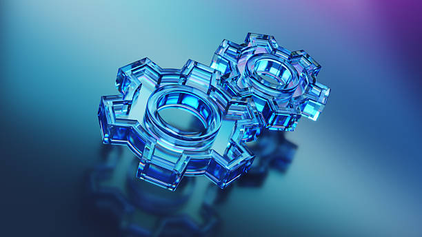 Blue glass gear shapes on a reflective surface with a gradient background, symbolizing technology, innovation, and mechanical concepts in a visually striking manner.
