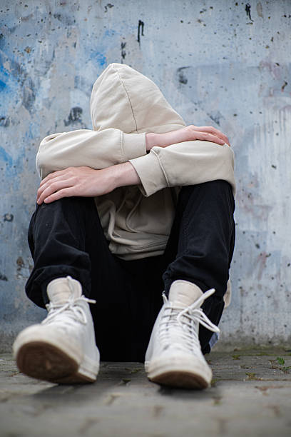 istock A Man Feeling Depressed and Anxious, Covering His Face In His Hands 2220228136