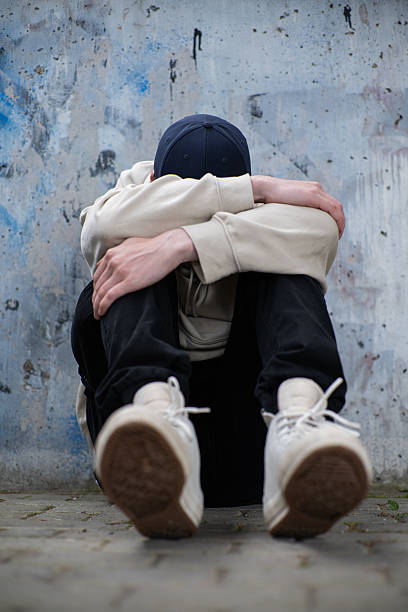 istock A Man Feeling Depressed and Anxious, Covering His Face In His Hands 2220228148