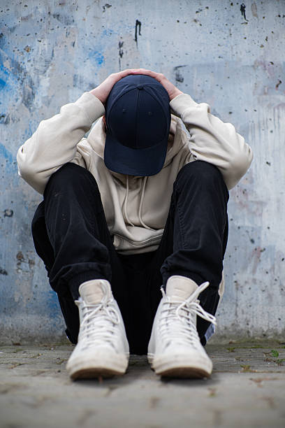 istock A Man Feeling Depressed and Anxious, Covering His Face In His Hands 2220228168