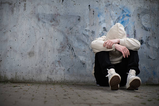 istock A Man Feeling Depressed and Anxious, Covering His Face In His Hands 2220228171