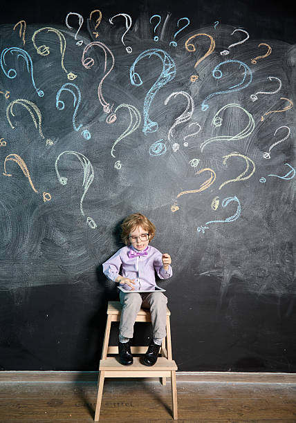 istock Smart boy searches for answers to his questions on his tablet 2220234190