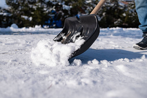 istock black shovel removing snow 2220234881
