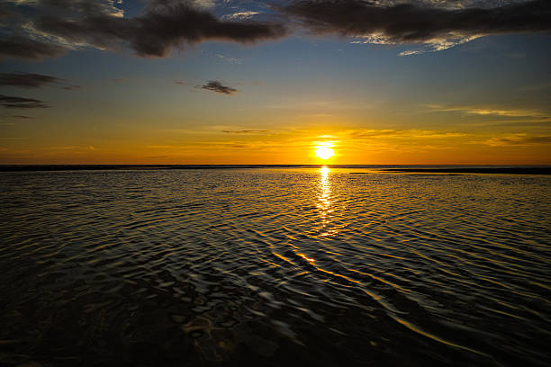 istock Stunning Sunset Over Calm Ocean Waters 2220240717