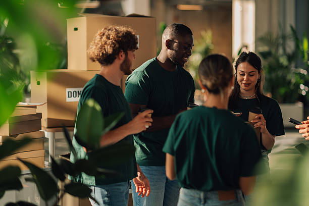 istock Volunteers chatting and drinking coffee during break time 2220243059