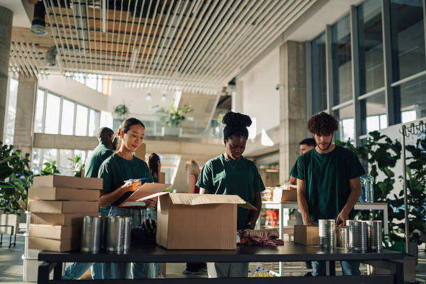 istock Volunteers preparing donation boxes at charity organization 2220243282
