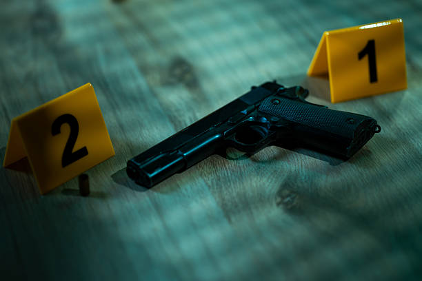 istock Gun at a crime scene 2220244973