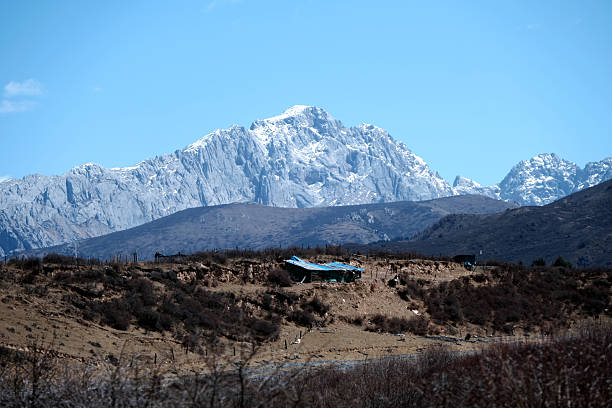 Snow mountain in Huanglong, a World Heritage Site by UNESCO in 1992 because of its outstanding travertine formations, waterfalls and limestone formations as well as its travertine terraces and lakes rating among the three most outstanding examples in the world. Sichuan, China.