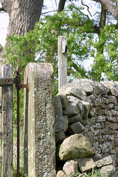 istock Close up of a dry stone wall with a stone post 2220248021
