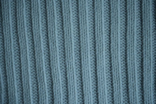 istock light blue knitted stockinette texture close-up – front side of wool fabric 2220248934