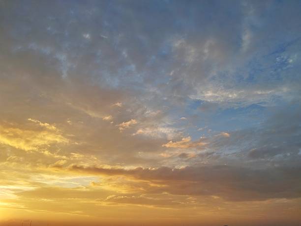 istock Dramatic sunrise sky view with clouds in summer season 2220250526