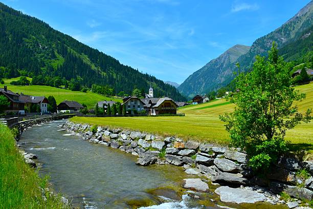 istock Fields and Muhr village next to Mur river bellow the mountains in Central eatern alps, Austria 2220256083