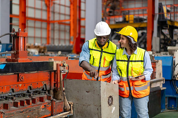 istock female engineer supervisor advice technician foreman to inspect and check spare part 2220256791
