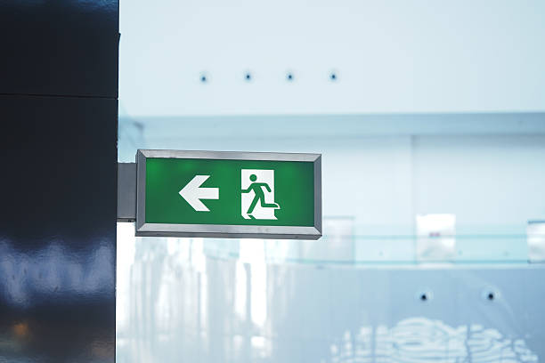 istock Exit sign directing towards the left in a modern indoor space 2220261850