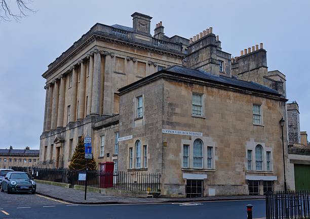 istock A large stone building with classical architectural elements stands on a street corner. 2220266928