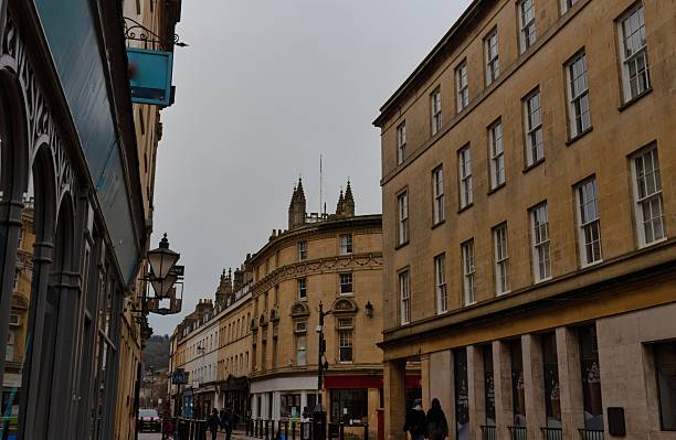 istock A street scene with old, yellow buildings under a cloudy sky. 2220267152