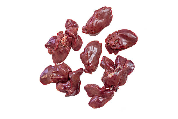 istock Poultry raw liver pieces scattered and isolated on white background 2220274544