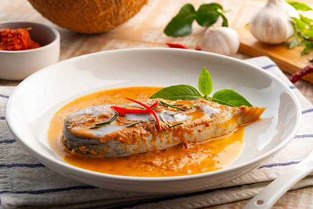 istock Siriped catfish with dried red curry sauce. 2220275247