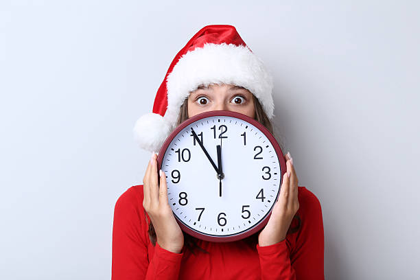 istock Beautiful girl with round clock on grey background 2220276706