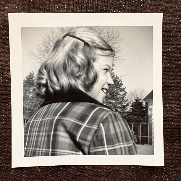 Young girl in plaid coat 1960s