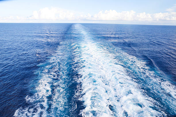 istock Trail on water surface behind of cruise ship 2220283736
