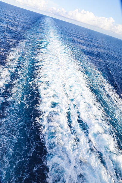 istock Trail on water surface behind of cruise ship 2220283745