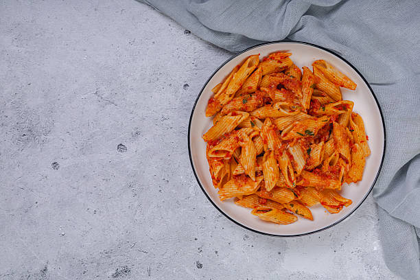 istock Pasta spaghetti Bolognese with red tomato souse on white plate on isolated white background. 2220287211
