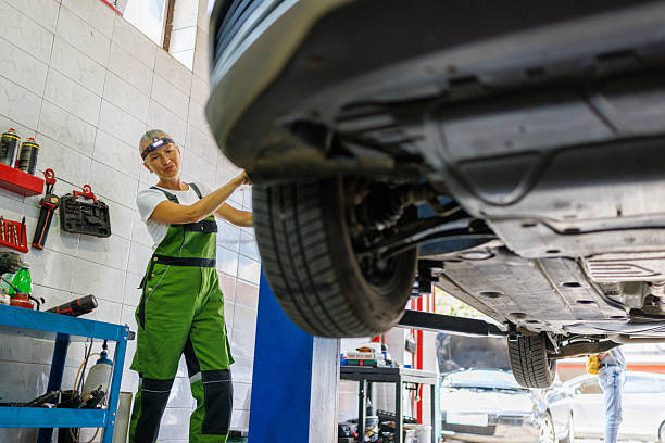 istock SUV Lifted in Auto Repair Bay 2220288900