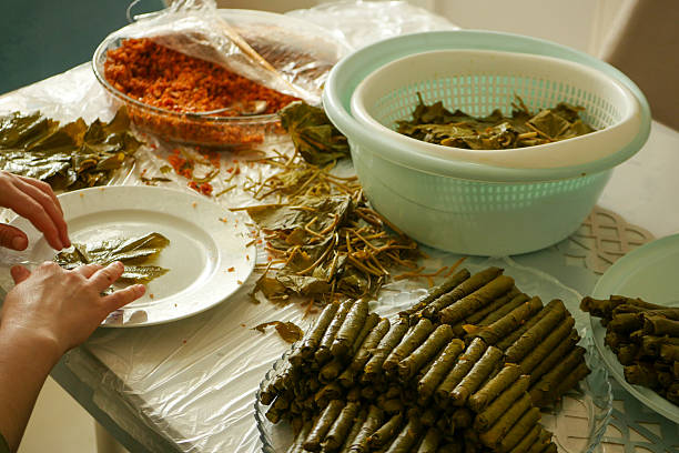 istock A housewife wraps homemade vine-grape leaf stuffing, 2220289715