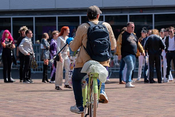 Bicycle Man Looking For Cans And Bottles At Amsterdam The Netherlands 30-5-2025