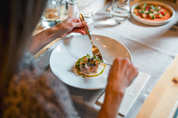 istock Elegant Fine Dining Experience With Gourmet Plate And Delicate Table Setting At Upscale Restaurant 2220290302
