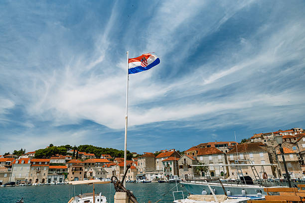 A photograph of the promenade in Trogir, Croatia. The photograph was created on a hot summer day.